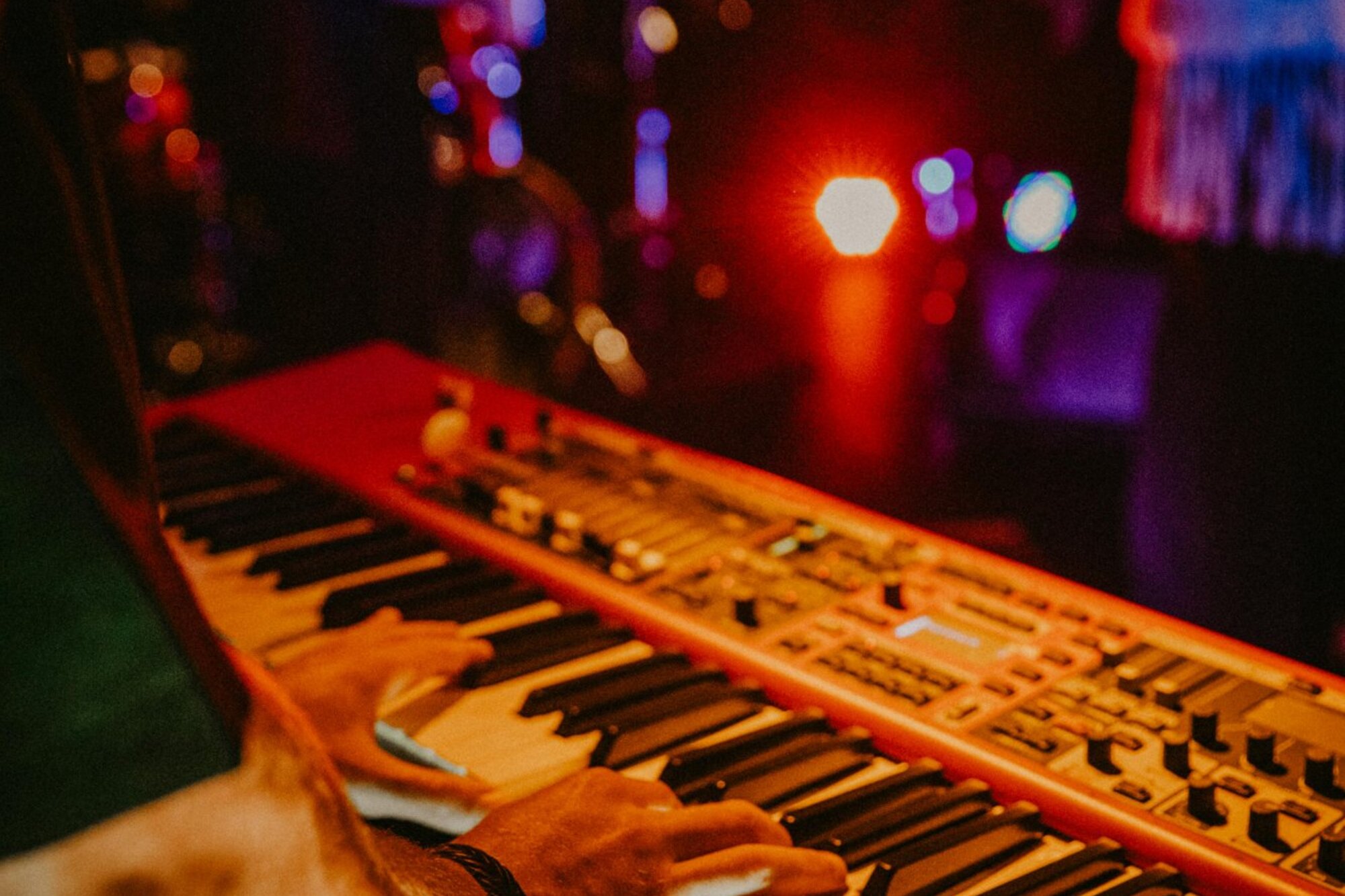Keyboard in warm stage lighting